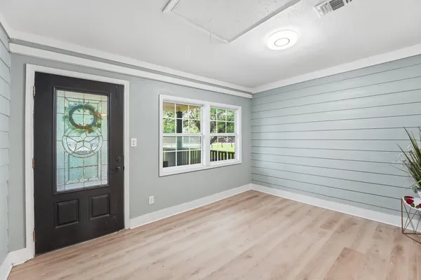 a view of an empty room with a window