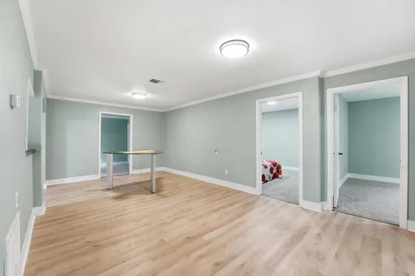 wooden floor and white walls