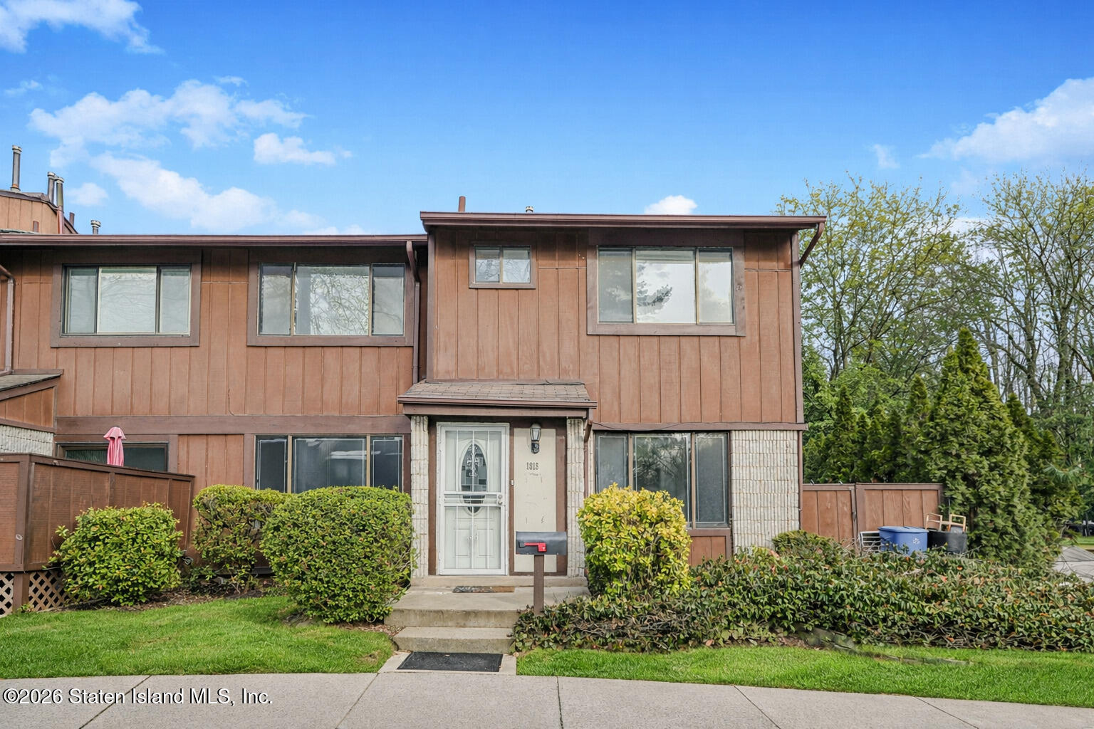 1818 Forest Hill Road Staten Island, NY 10306 - Photo 1 of 36 a front view of a house with garden