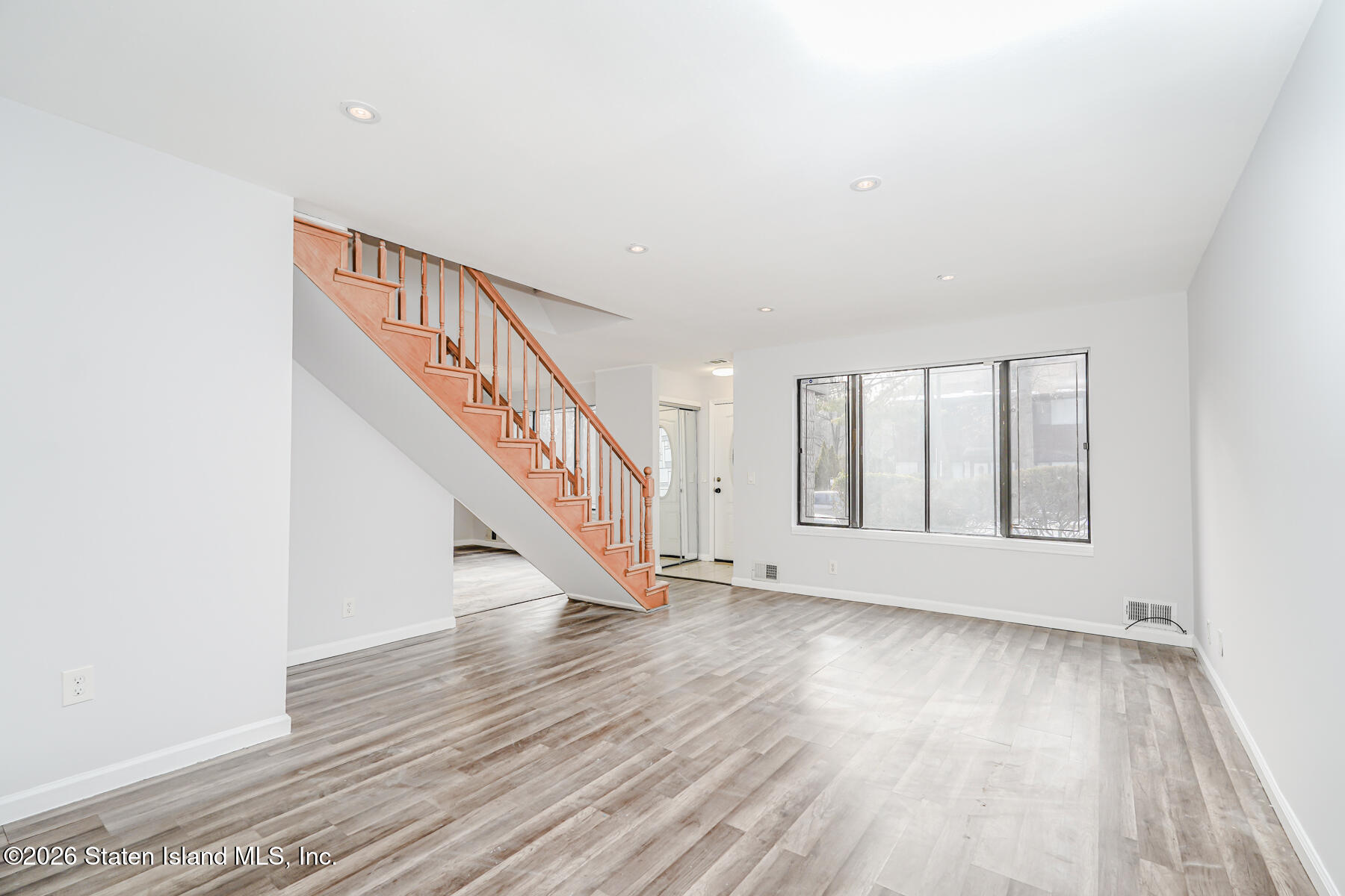 1818 Forest Hill Road Staten Island, NY 10306 - Photo 11 of 36 a view of an entryway with wooden floor