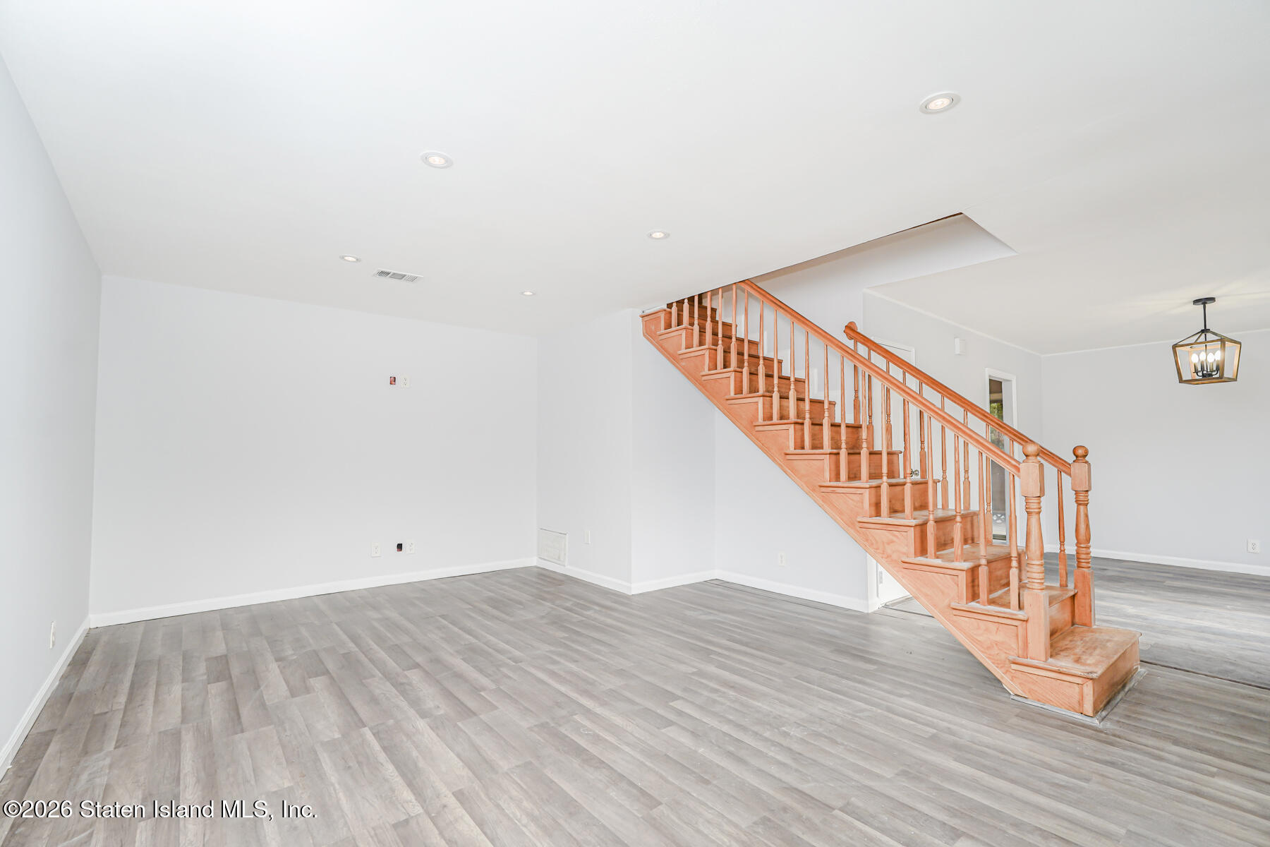 1818 Forest Hill Road Staten Island, NY 10306 - Photo 12 of 36 a view of room with wooden floor
