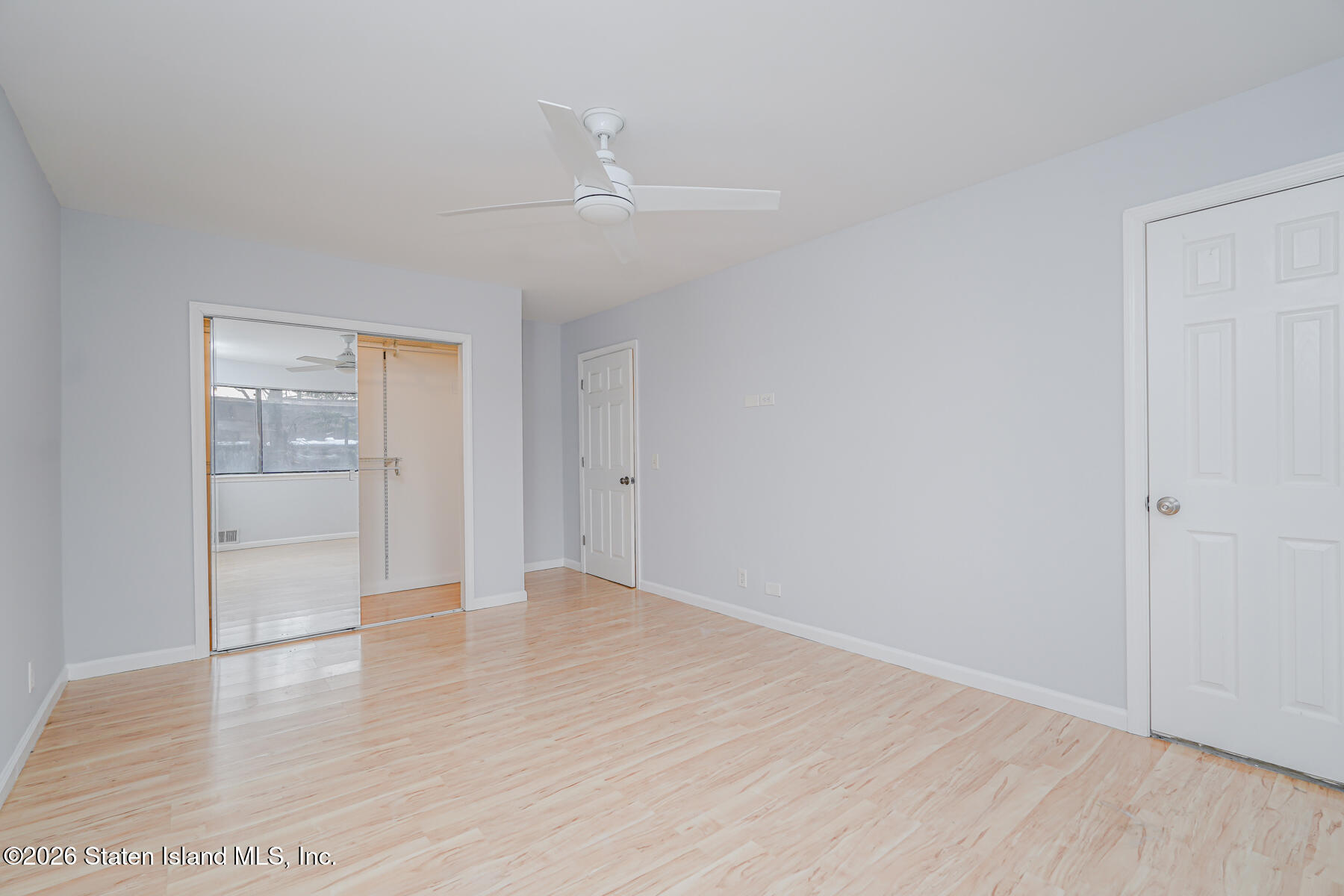 1818 Forest Hill Road Staten Island, NY 10306 - Photo 16 of 36 wooden floor in an empty room