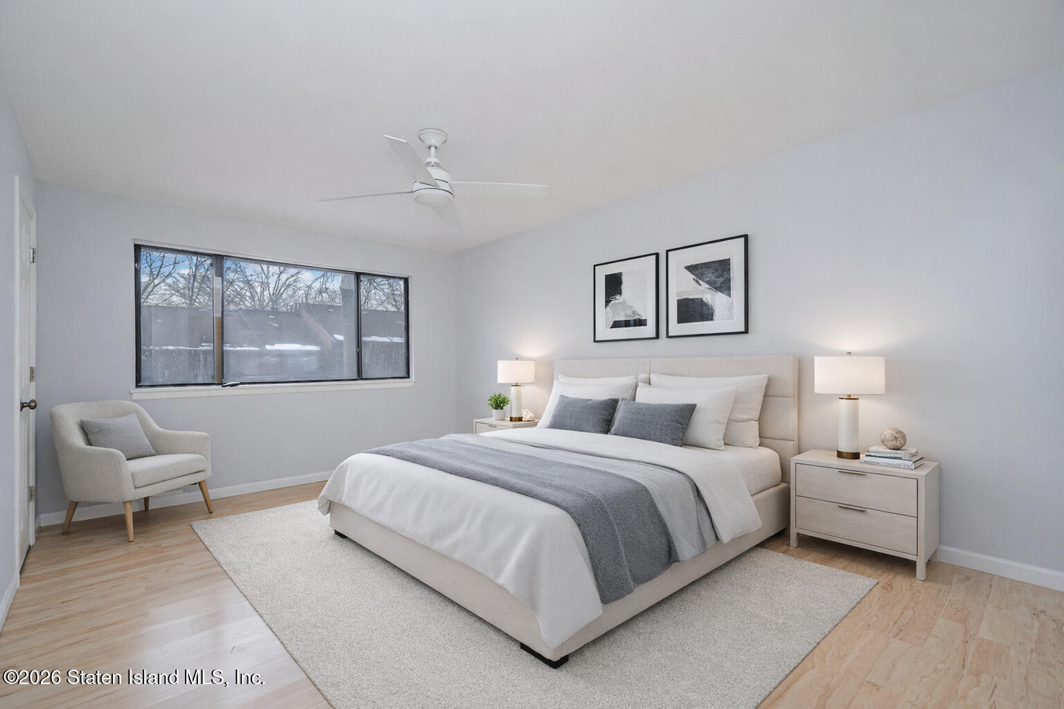 1818 Forest Hill Road Staten Island, NY 10306 - Photo 18 of 36 a bedroom with a large bed and a window