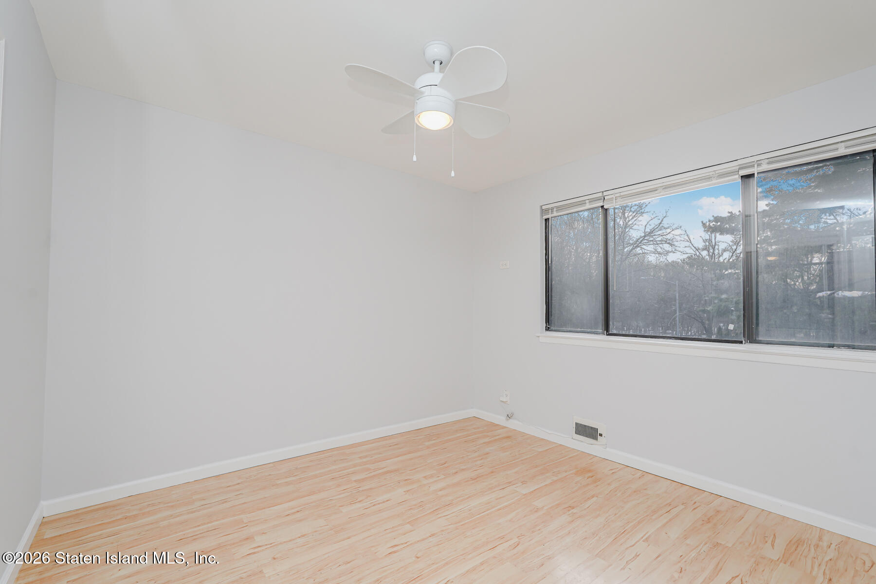 1818 Forest Hill Road Staten Island, NY 10306 - Photo 23 of 36 a view of an empty room with a window