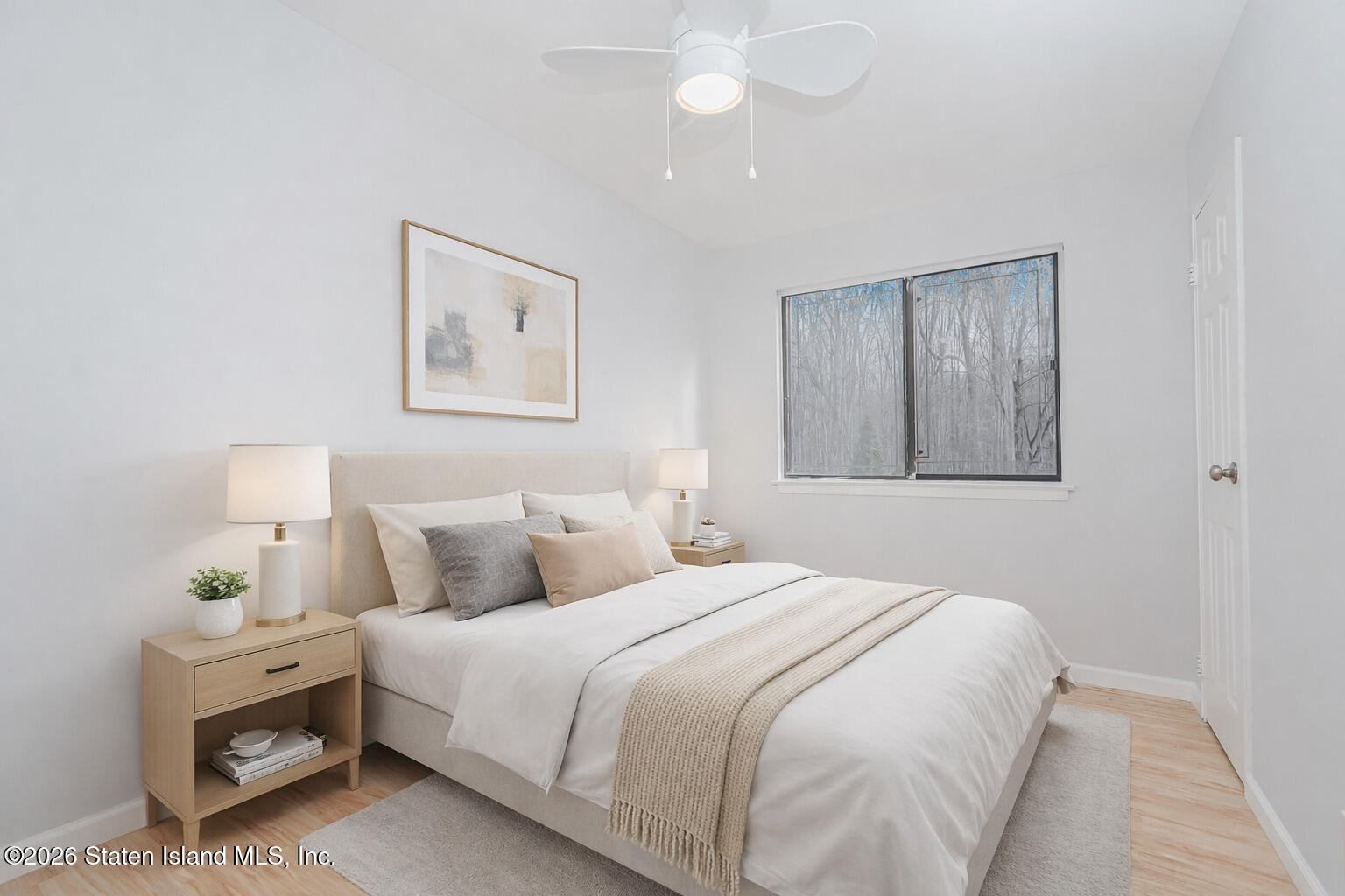 1818 Forest Hill Road Staten Island, NY 10306 - Photo 27 of 36 a bedroom with a bed and a painting on the wall