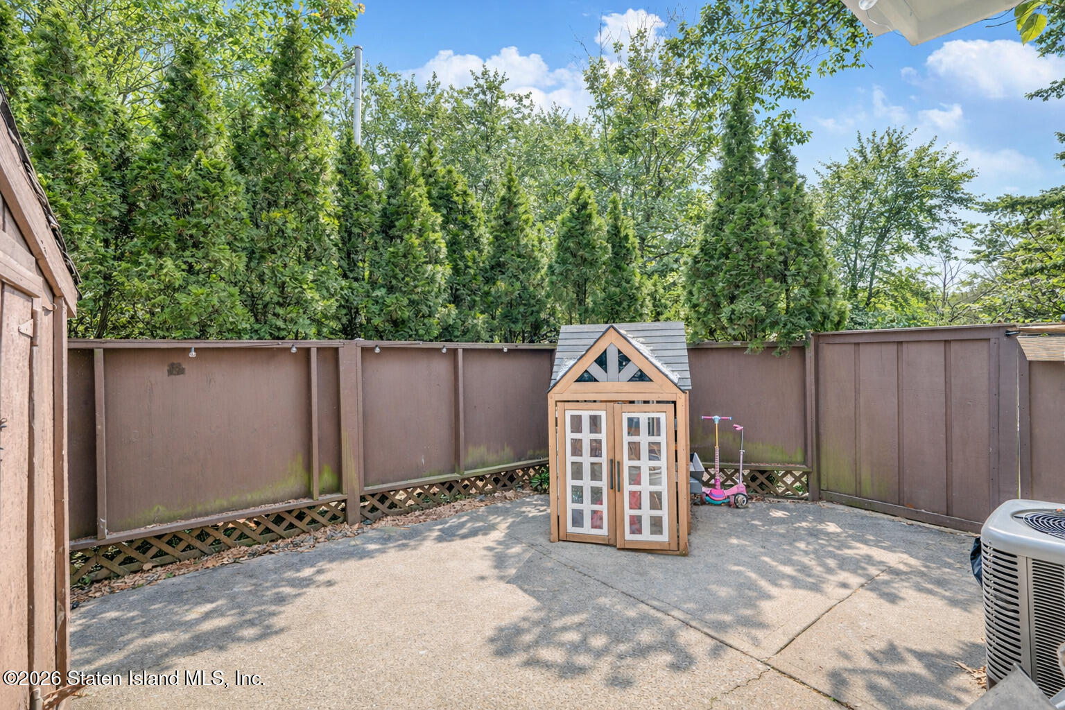 1818 Forest Hill Road Staten Island, NY 10306 - Photo 29 of 36 a view of a wooden fence