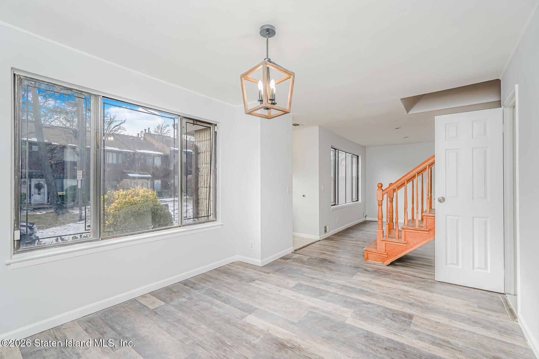 1818 Forest Hill Road Staten Island, NY 10306 - Photo 3 of 36 a view of an entryway with wooden floor and windows
