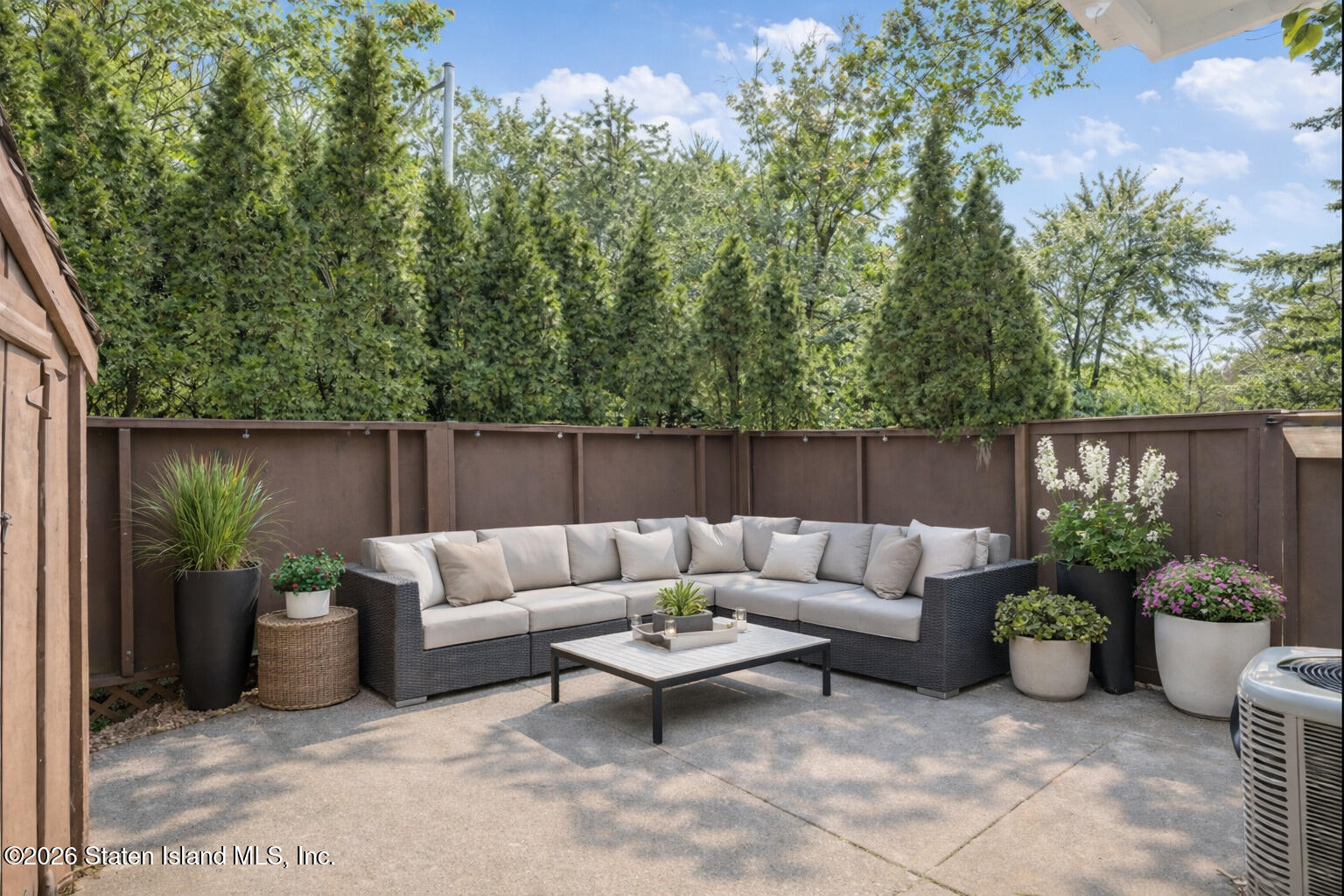 1818 Forest Hill Road Staten Island, NY 10306 - Photo 31 of 36 a view of a patio with couches and potted plants