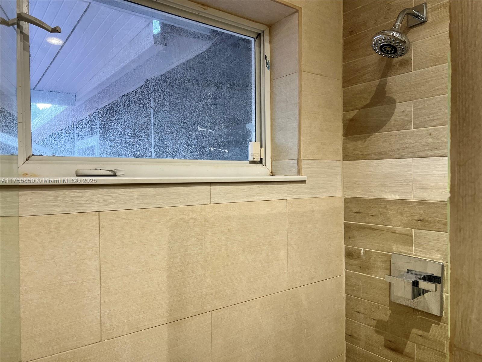 480 Northwest 16th Street Homestead, FL 33030 - Photo 13 of 14 a bathroom with a shower