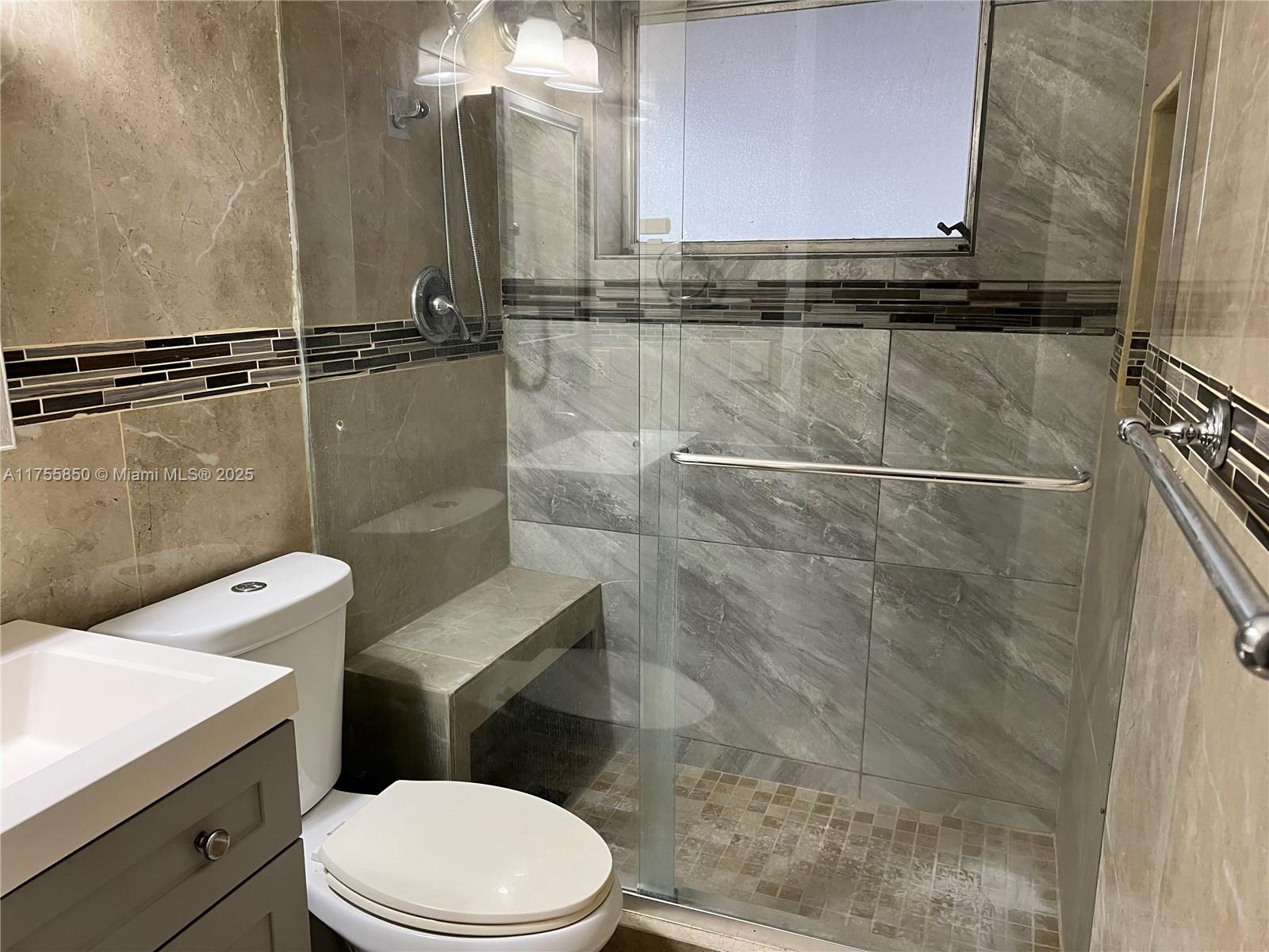 480 Northwest 16th Street Homestead, FL 33030 - Photo 14 of 14 a bathroom with a toilet and a shower