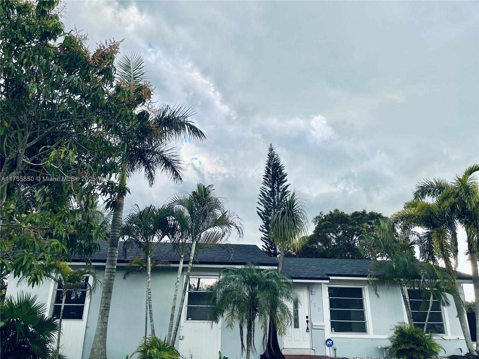 480 Northwest 16th Street Homestead, FL 33030 - Photo 2 of 14 a view of swimming pool with lawn chairs and plants
