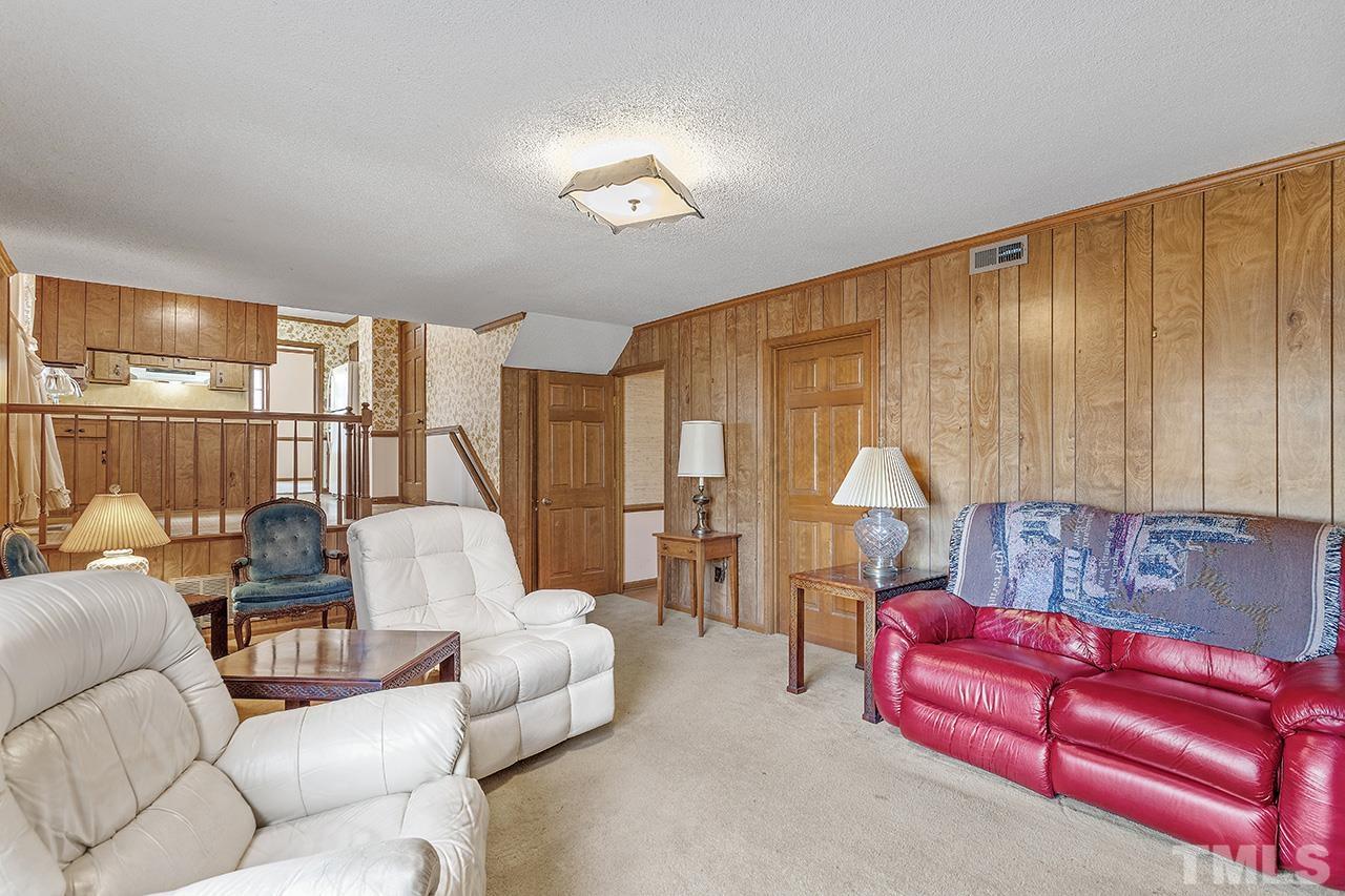 241 Fairview Road Cary, NC 27511 - Photo 16 of 34 a living room with furniture and a large window