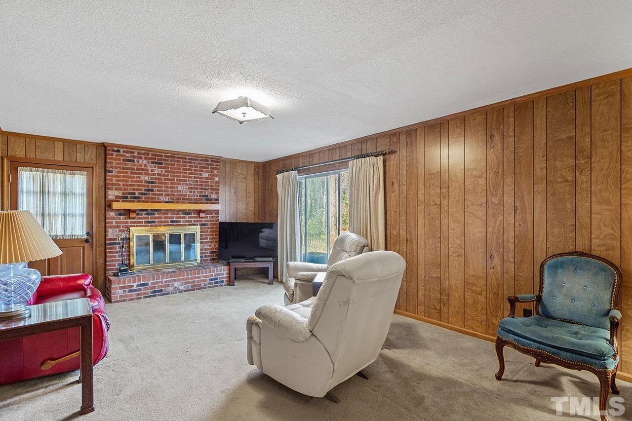241 Fairview Road Cary, NC 27511 - Photo 17 of 34 a living room with furniture and a floor to ceiling window