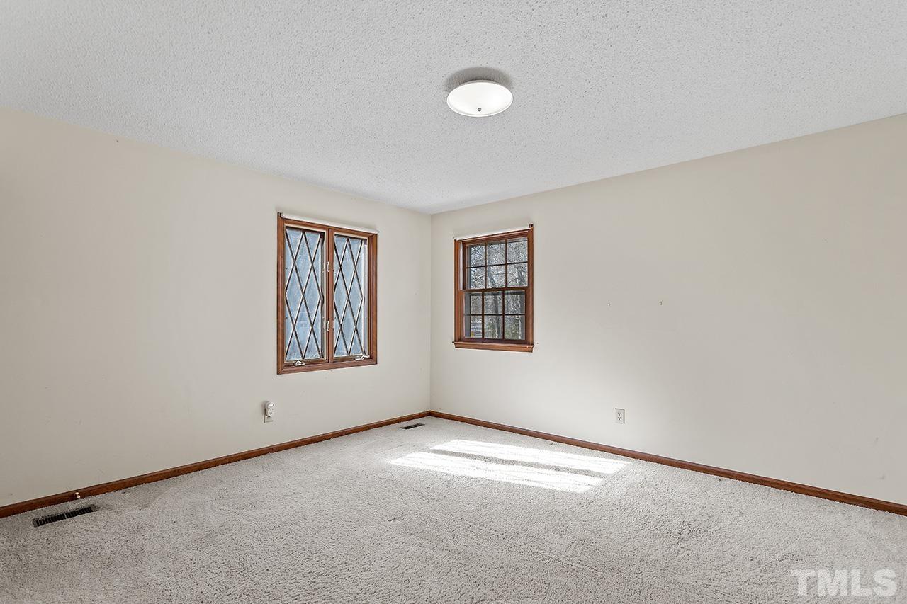 241 Fairview Road Cary, NC 27511 - Photo 23 of 34 an empty room with windows