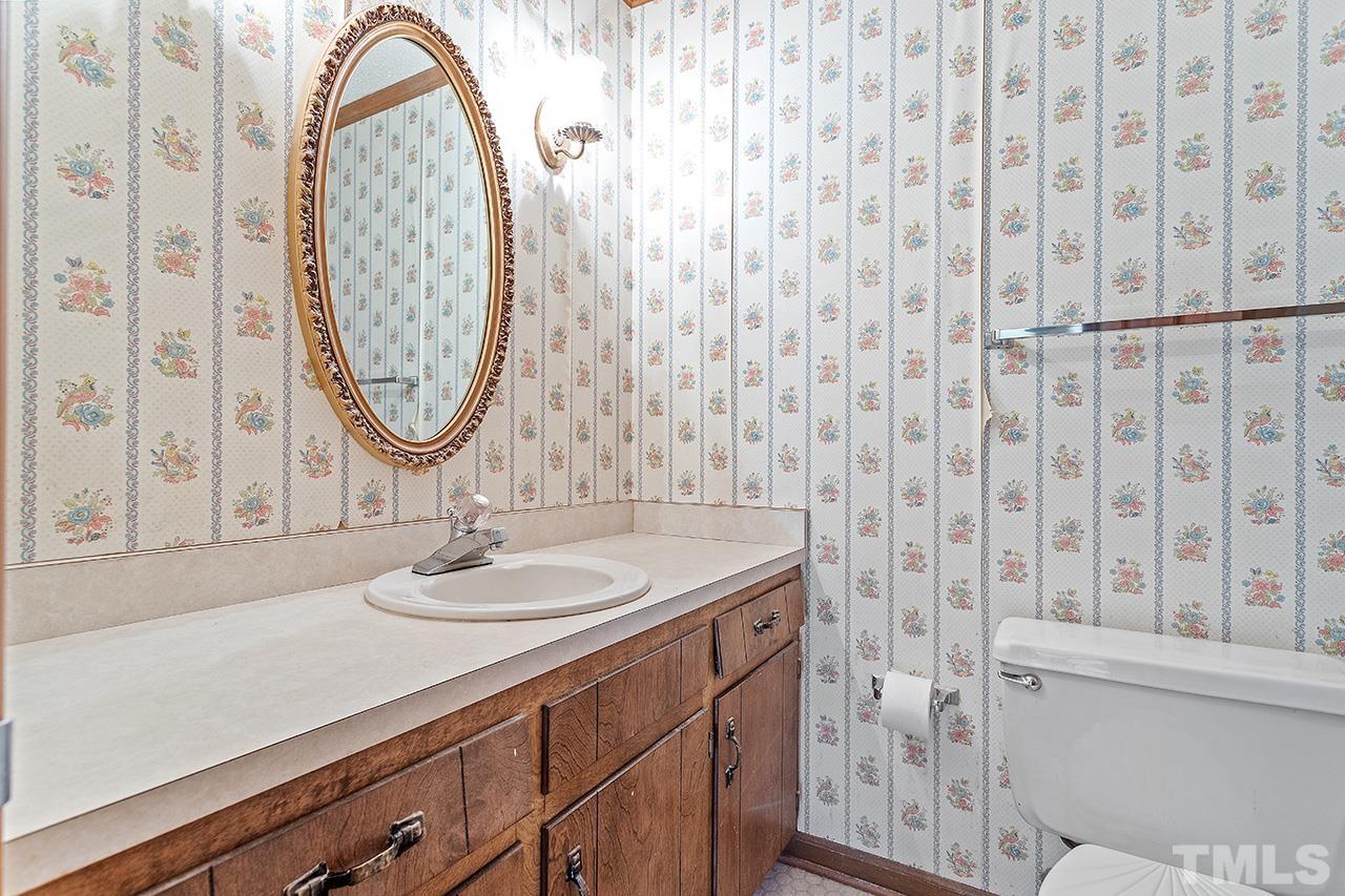 241 Fairview Road Cary, NC 27511 - Photo 29 of 34 a bathroom with 2 sink and a mirror