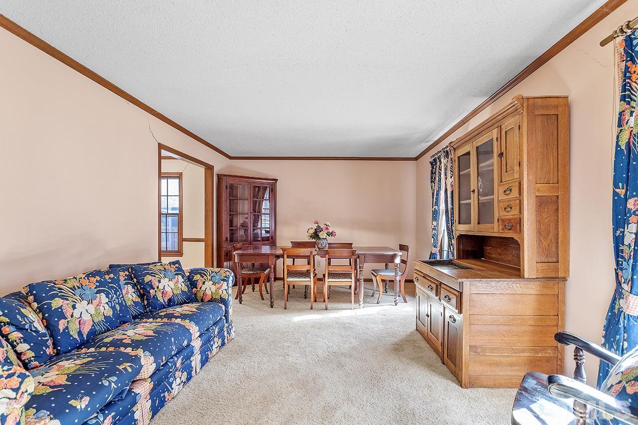 241 Fairview Road Cary, NC 27511 - Photo 5 of 34 a living room with furniture and a flat screen tv