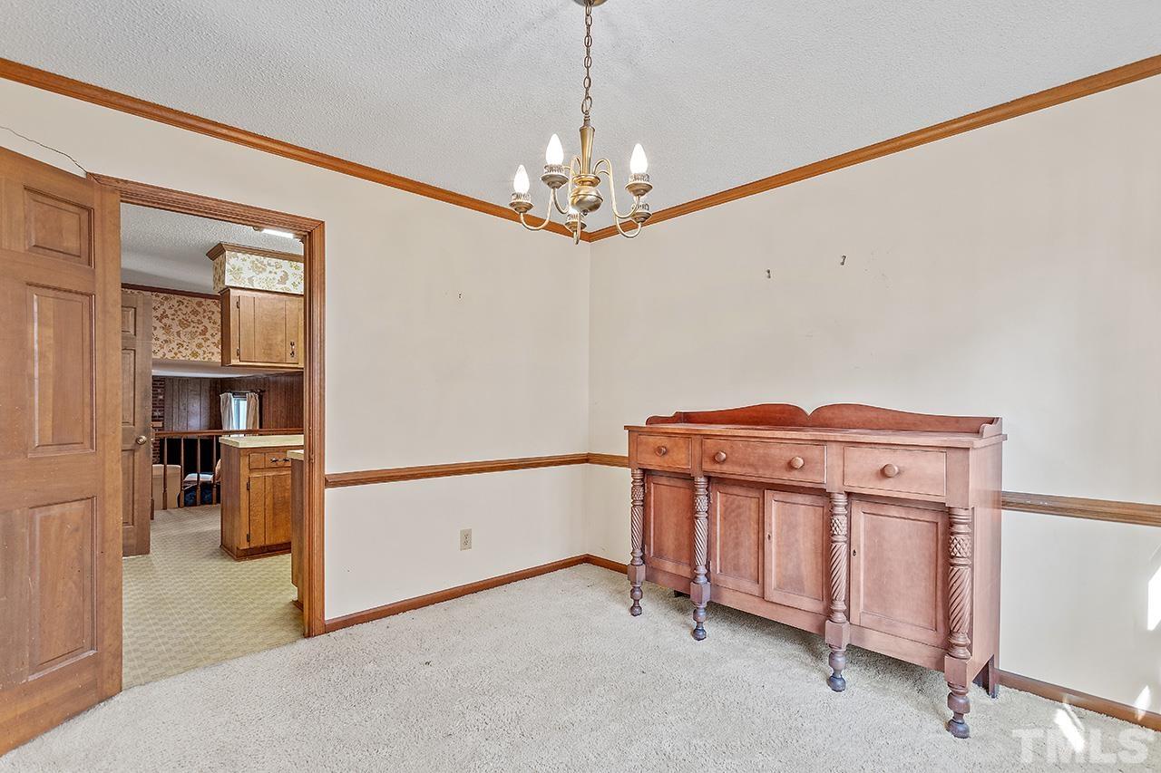 241 Fairview Road Cary, NC 27511 - Photo 9 of 34 a view of a livingroom with a chandelier
