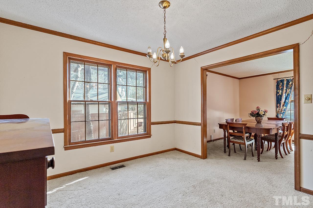 241 Fairview Road Cary, NC 27511 - Photo 10 of 34 a view of a livingroom with furniture window and wooden floor