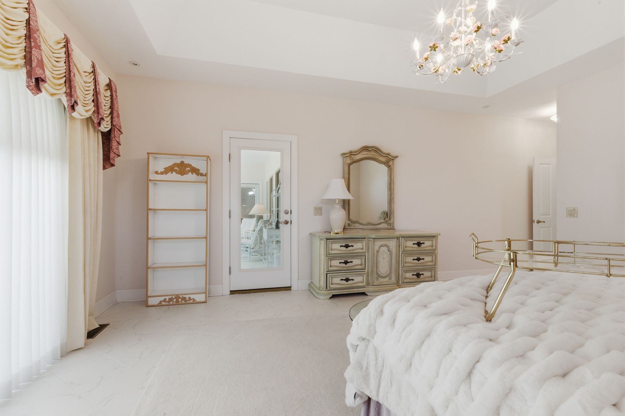 528 Country Club Drive Dickson, TN 37055 - Photo 37 of 55 a bedroom with a bed and a chandelier