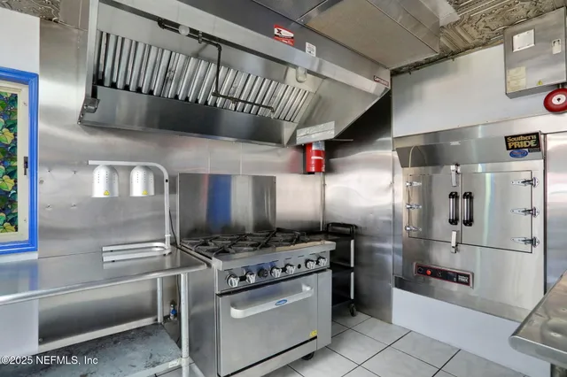 a bathroom with a glass shower door and a sink