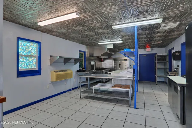 a living room with furniture a dining table and a piano