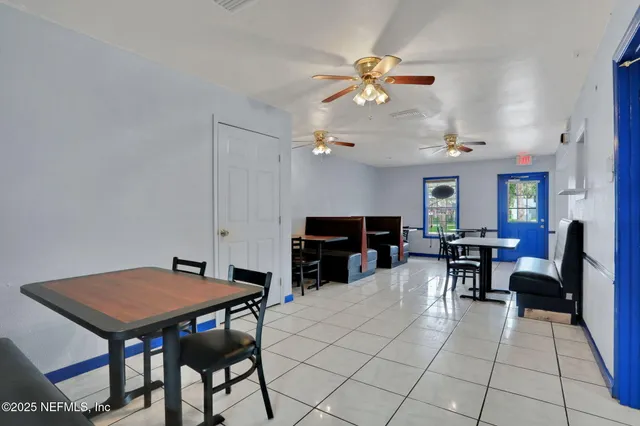 a view of a workspace with furniture