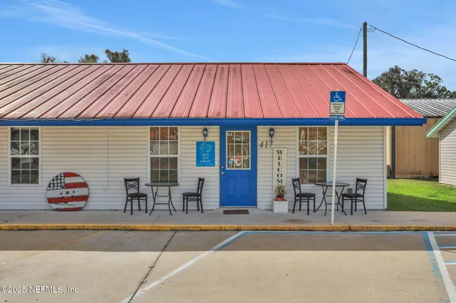 a view of a workspace with furniture