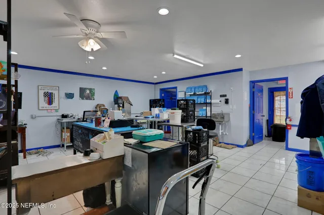 a work room with furniture and wooden floor