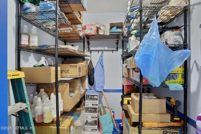 a view of an house with swimming pool and sitting area