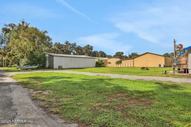 a view of a city with lush green forest