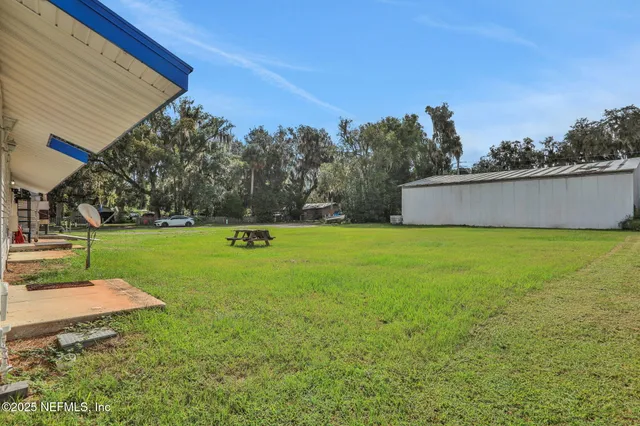 a view of a garden with an outdoor space