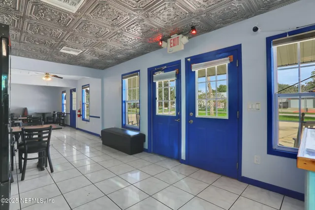 a view of a livingroom with furniture and window
