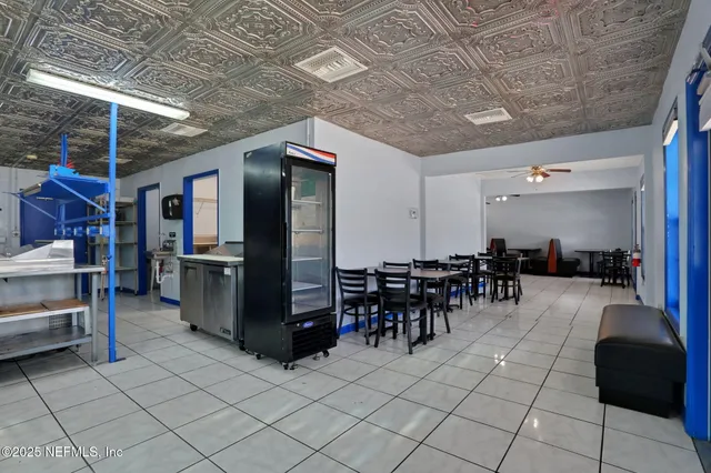 a view of a patio with table and chairs