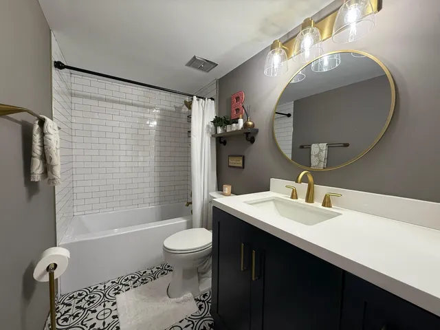 a kitchen with a refrigerator a stove top oven a sink dishwasher and wooden cabinets with wooden floor