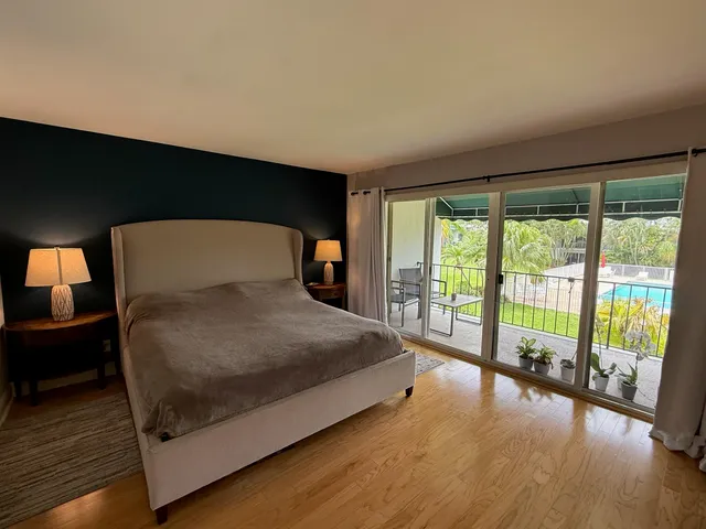 a bedroom with a bed and a television in it