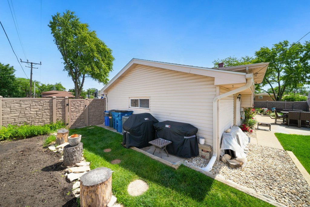 365 West Myrick Avenue Addison, IL 60101 - Photo 32 of 49 a view of a backyard with a patio
