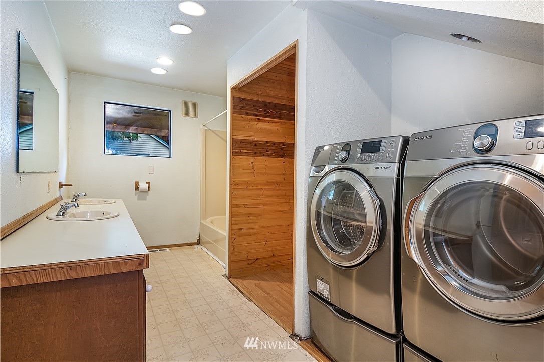26430 Lake Fenwick Road South Kent, WA 98032 - Photo 16 of 30 a utility room with dryer and washer