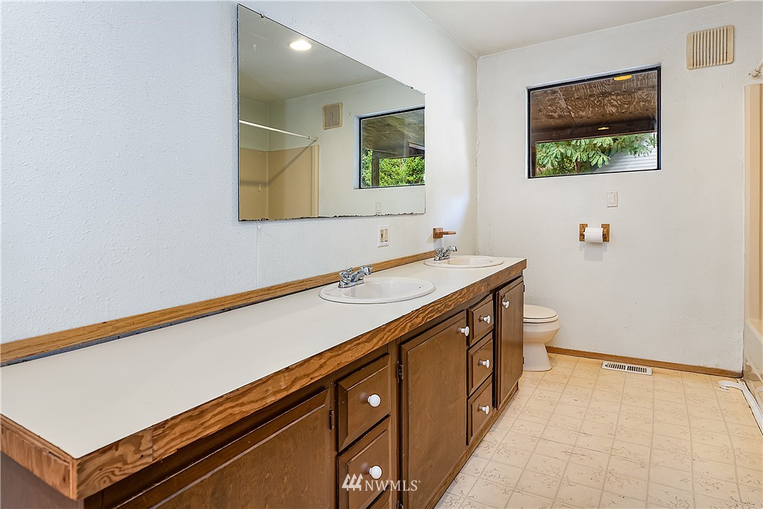 26430 Lake Fenwick Road South Kent, WA 98032 - Photo 17 of 30 a bathroom with a sink and a mirror