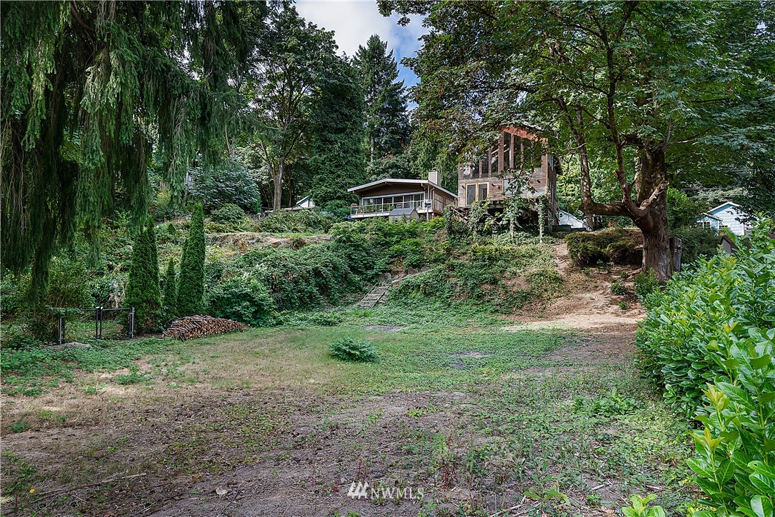 26430 Lake Fenwick Road South Kent, WA 98032 - Photo 20 of 30 a front view of a house with a yard and trees