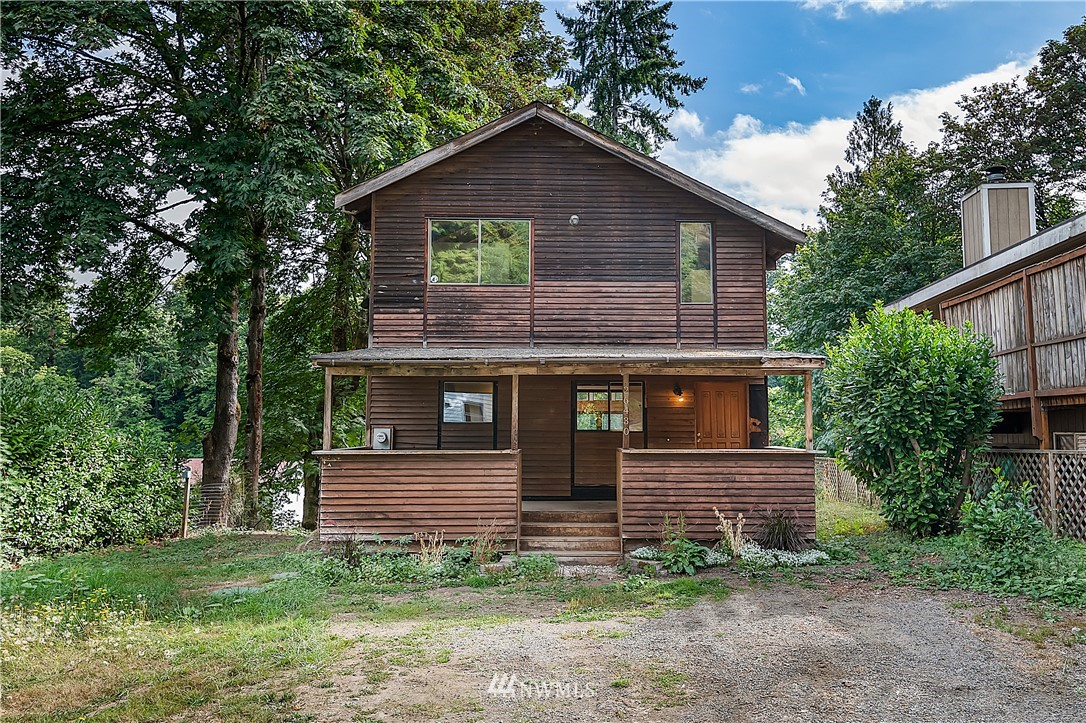 26430 Lake Fenwick Road South Kent, WA 98032 - Photo 3 of 30 a front view of a house with garden