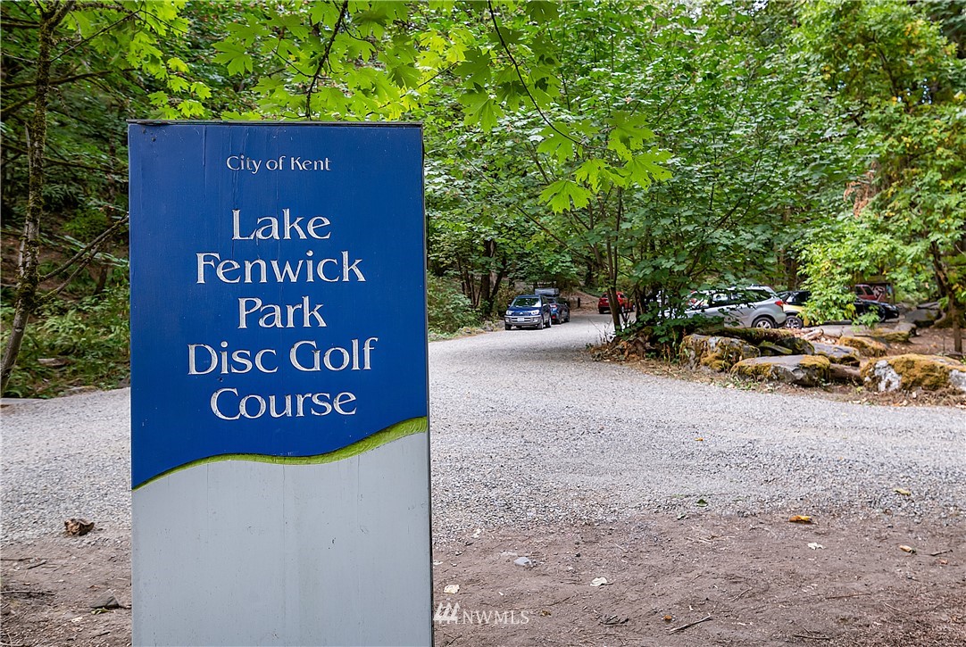 26430 Lake Fenwick Road South Kent, WA 98032 - Photo 29 of 30 a sign that is sitting on a brick wall