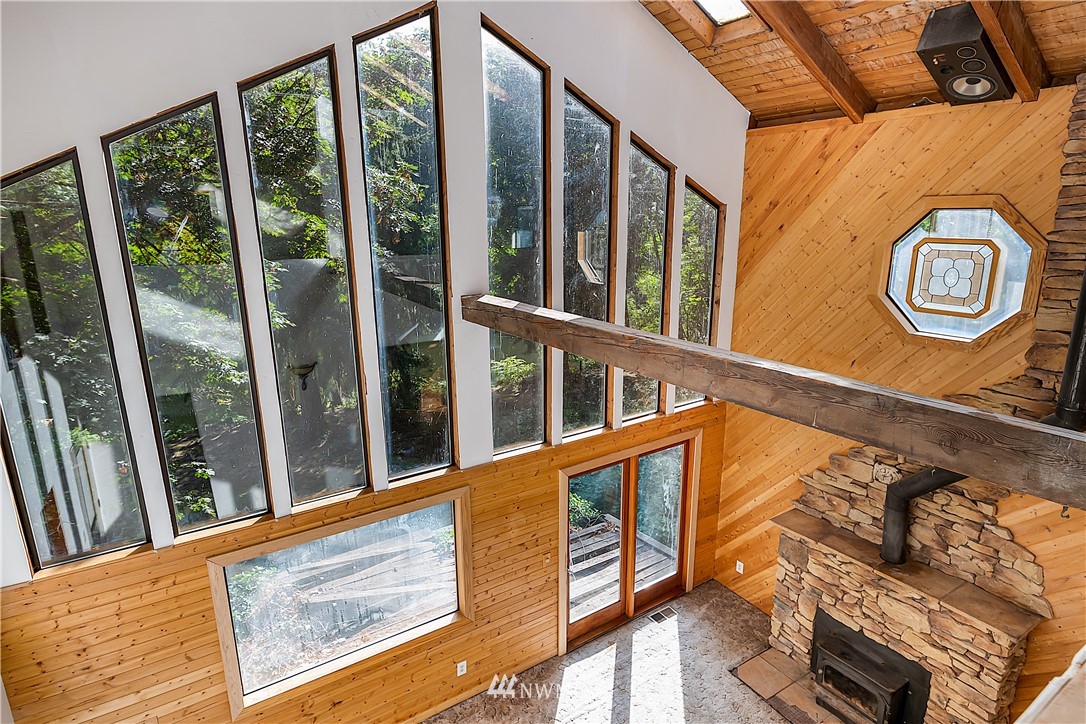 26430 Lake Fenwick Road South Kent, WA 98032 - Photo 5 of 30 a view of a balcony with furniture and large windows