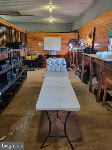 a view of a big yard with a small yard and wooden fence