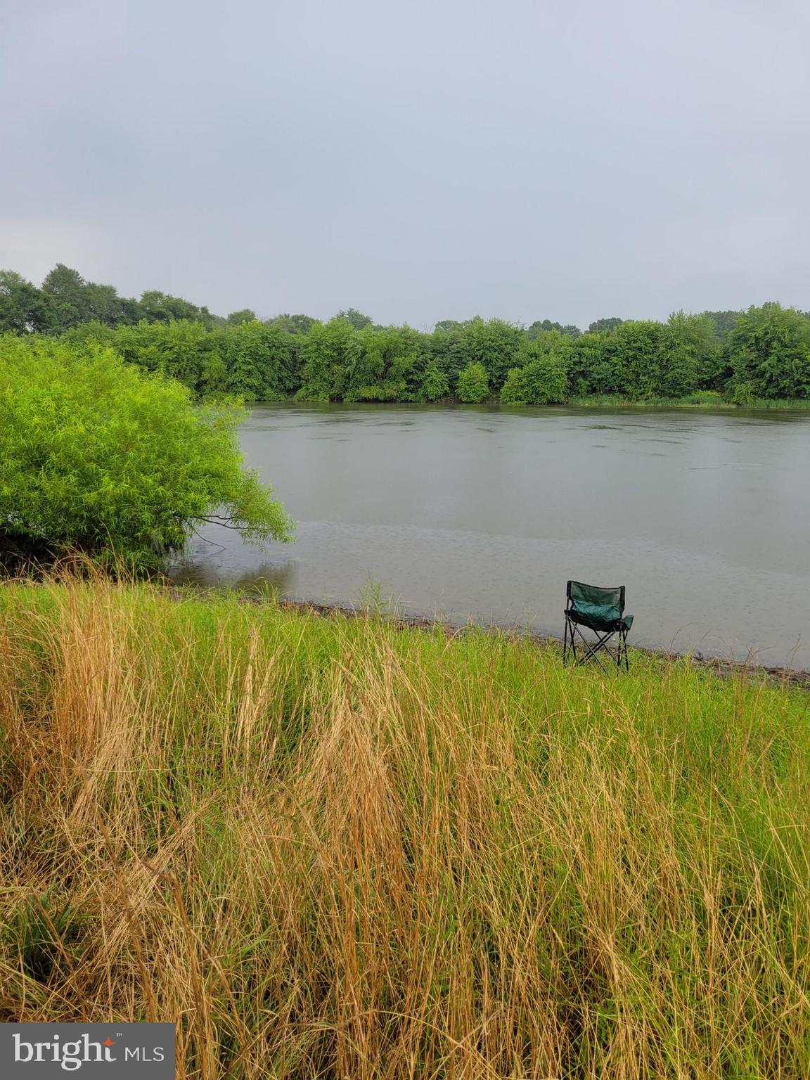 149 Brindletown Road New Egypt, NJ 08533 - Photo 20 of 29 a view of a lake with houses in the back