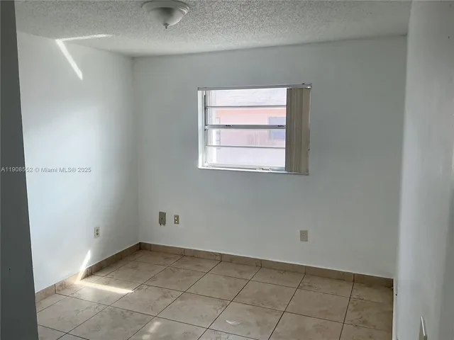 a view of a room that has a window in it