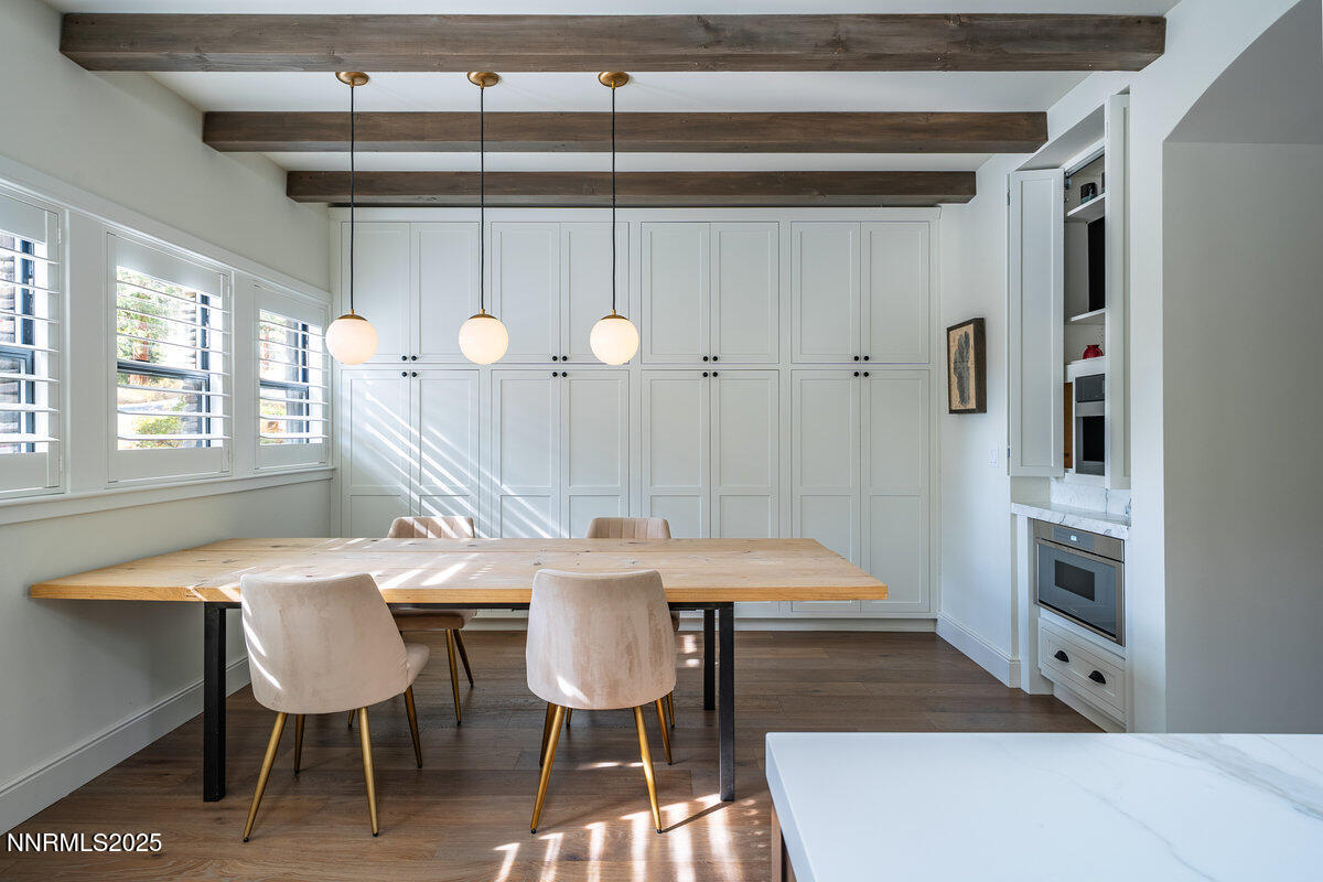 2 South Point Place Glenbrook, NV 89413 - Photo 18 of 49 a dining room with a table chairs and a painting on the wall