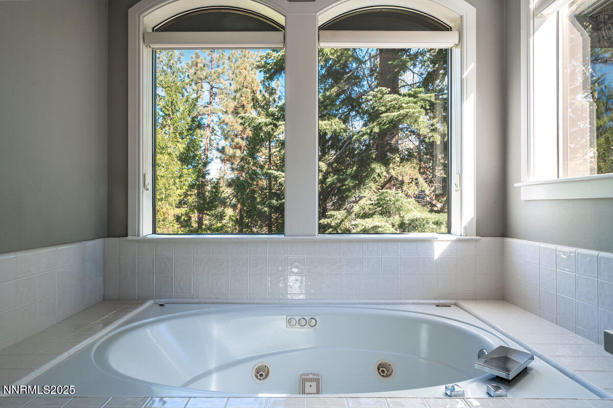 2 South Point Place Glenbrook, NV 89413 - Photo 29 of 49 a bathroom with a bathtub and window