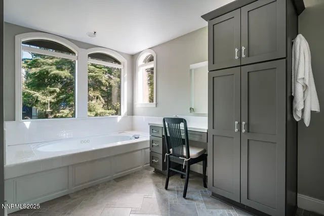 a bathroom with a bathtub and a shower