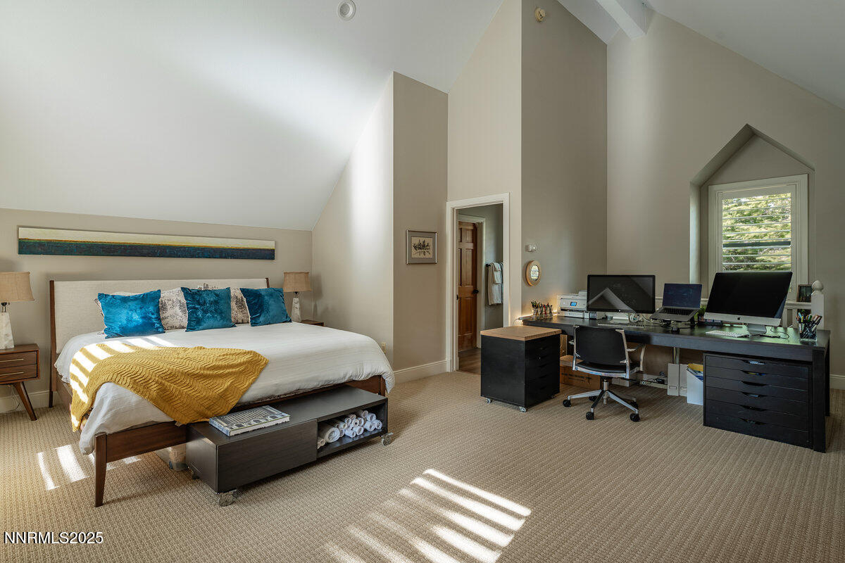 2 South Point Place Glenbrook, NV 89413 - Photo 33 of 49 a bedroom with a bed and a chandelier