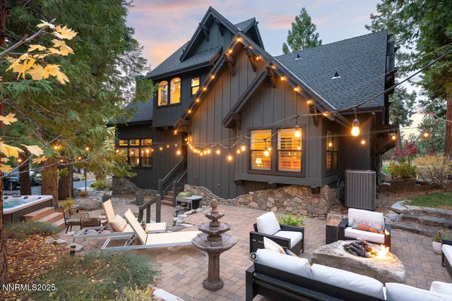 a view of a patio with couches table and chairs and potted plants
